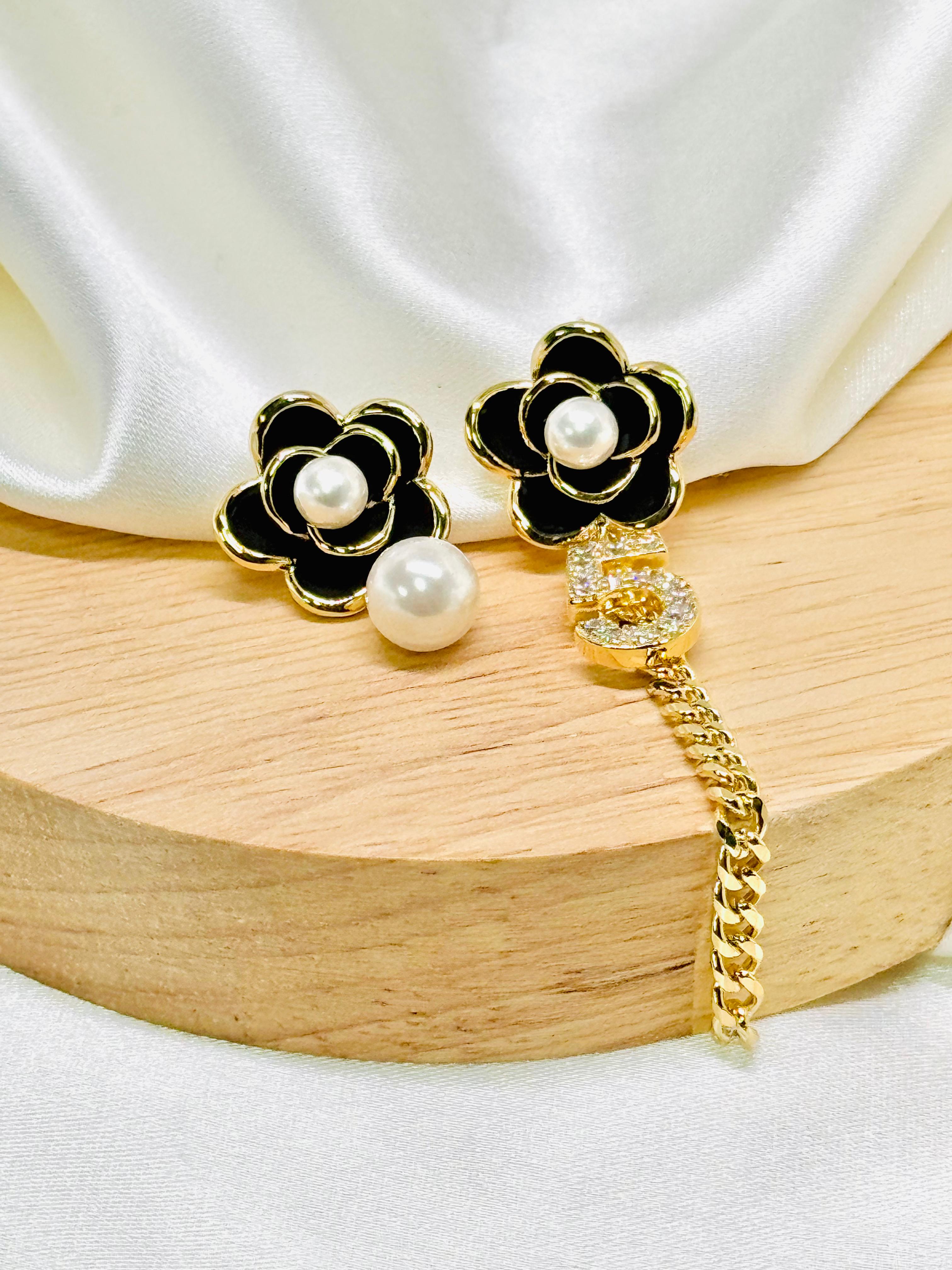 Aretes floreados negros rodio
