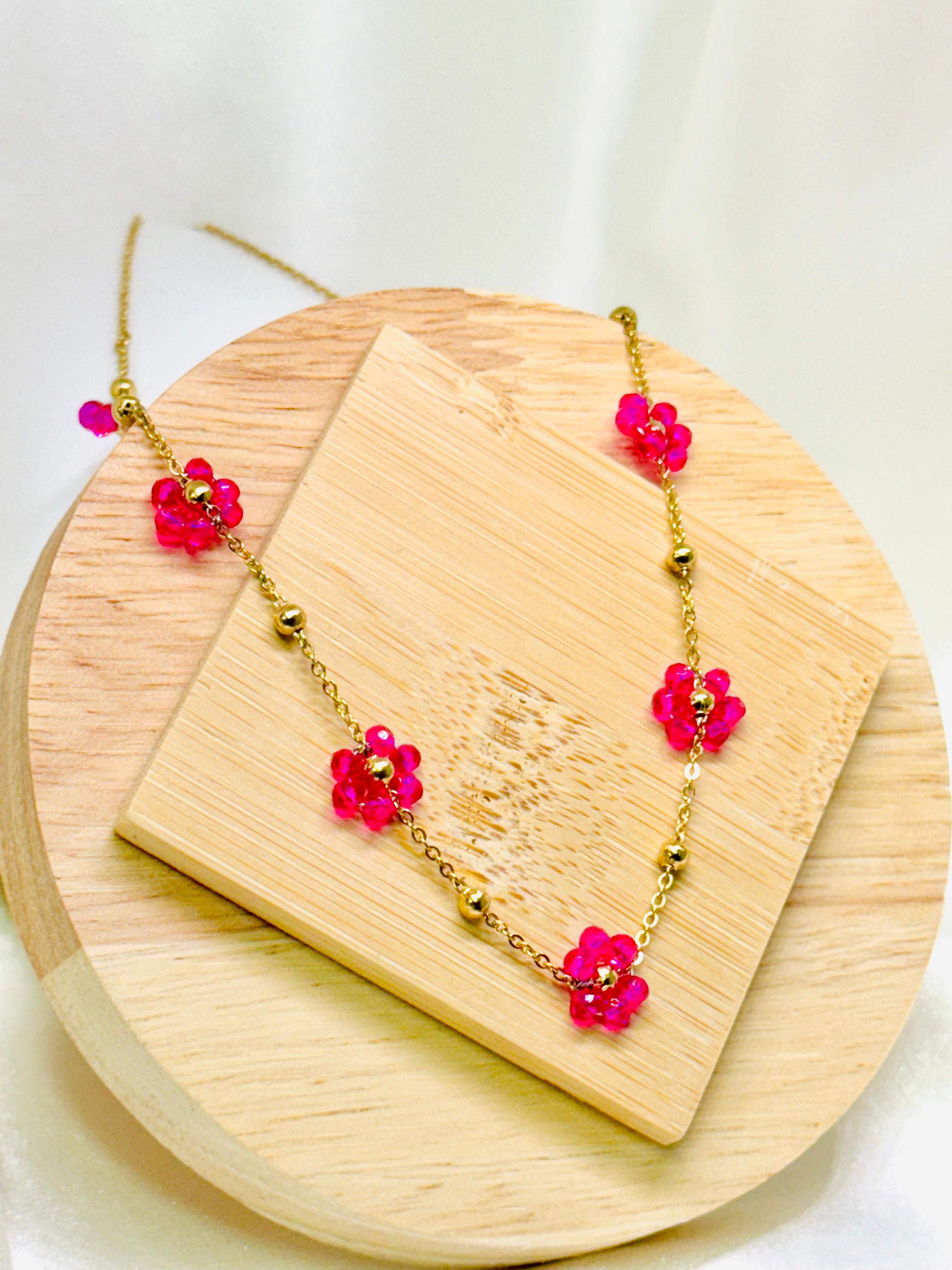 Collar flores fucsia